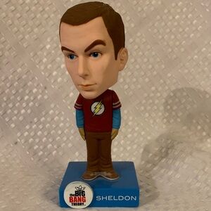 Sheldon Cooper Bobblehead - Red Shirt with The Flash  emblem. 7 inches high.
